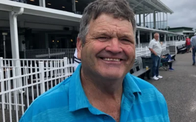 ARNETT BASKS IN SUNSHINE AND (RELATIVE) WARMTH, IS TRAINER OF MONTH