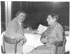 Steinbrenner with opera singer Robert Merrill sitting at a table