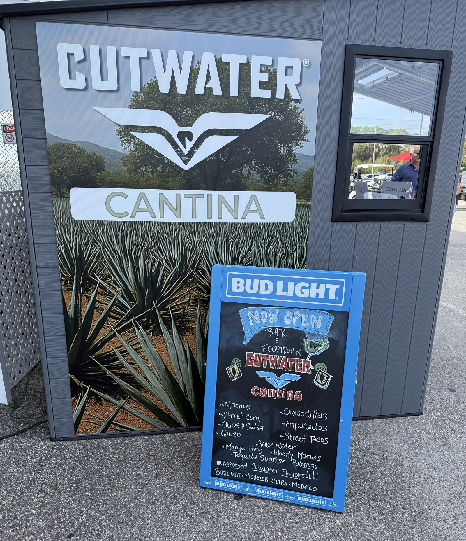guys in box seating looking out at track